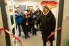 Woman cutting ribbon for Look exhibition