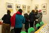 People looking at photos for Look Exhibition